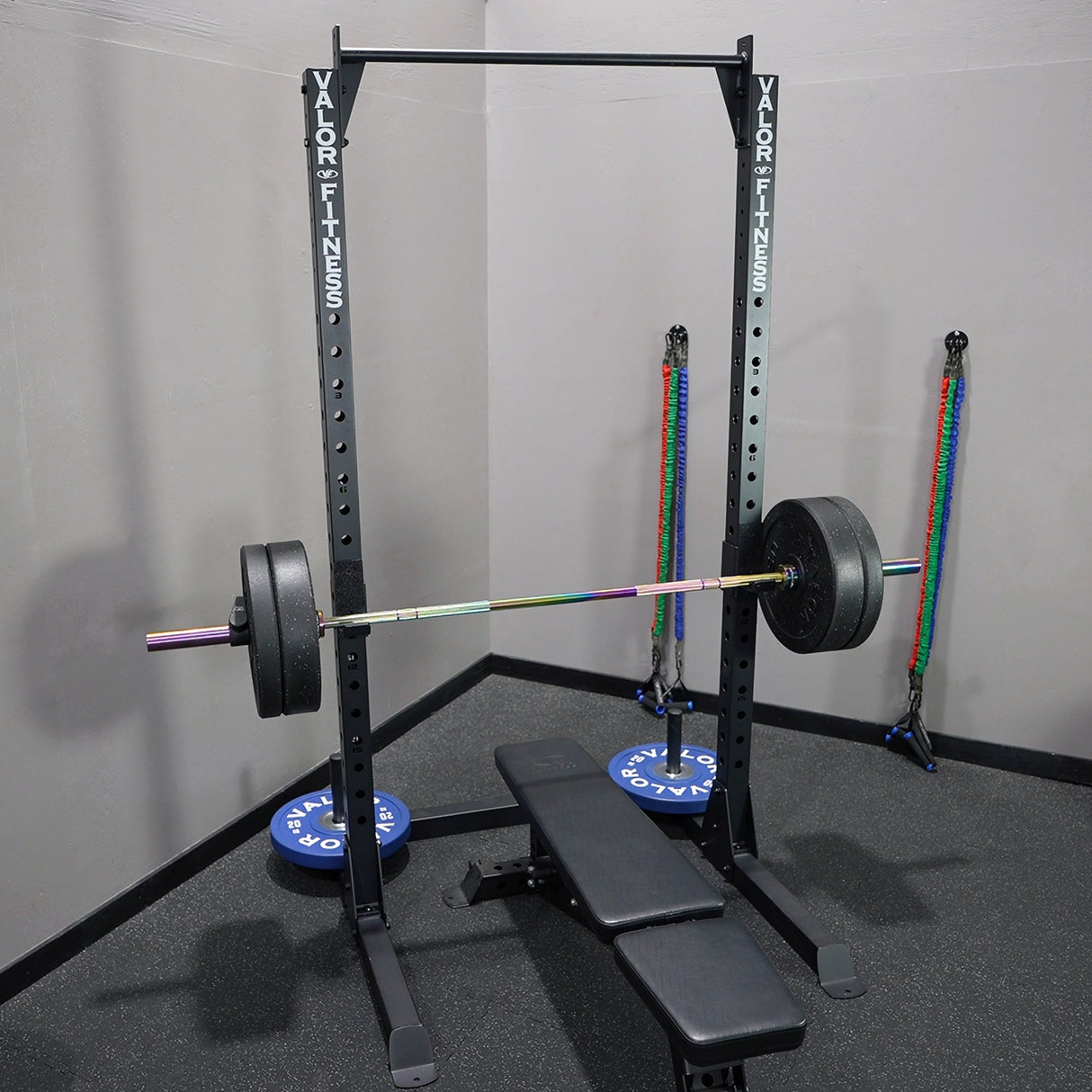 Squat rack with barbell and weight plates in a gym setting