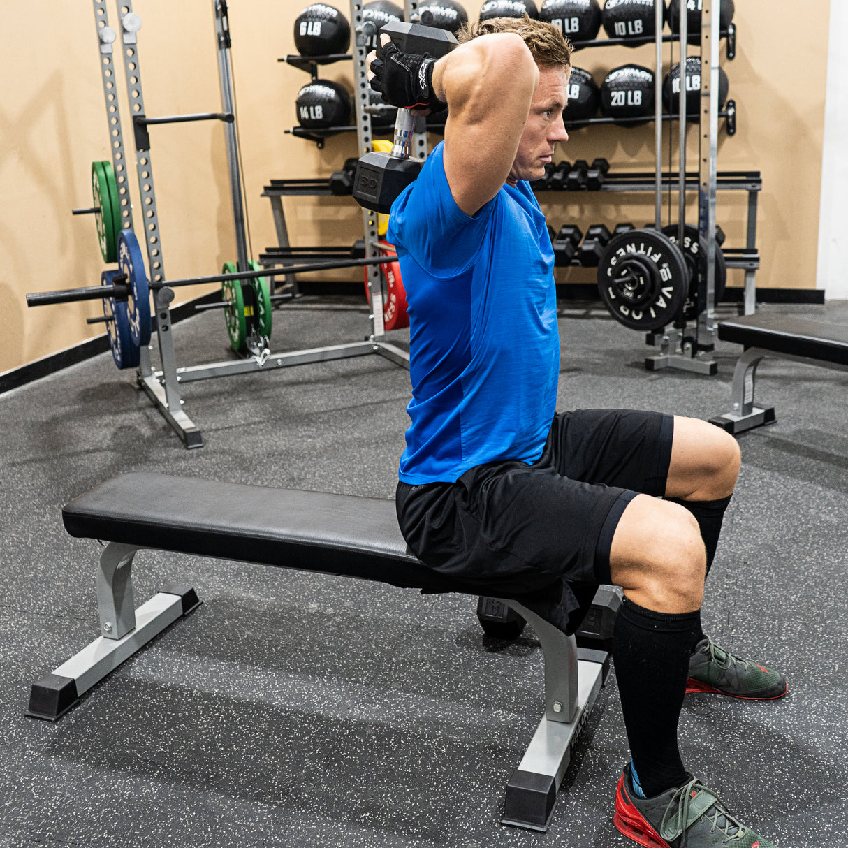 Overhead shoulder curls with a dumbbell