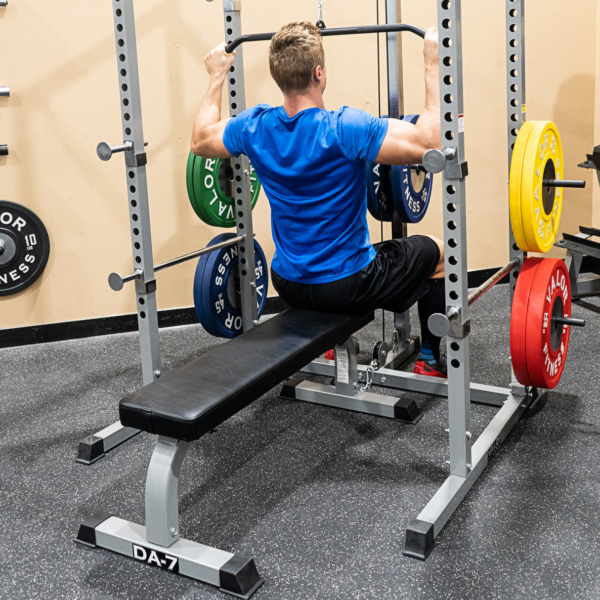 Using a flat weight bench to sit and do lat pulldowns