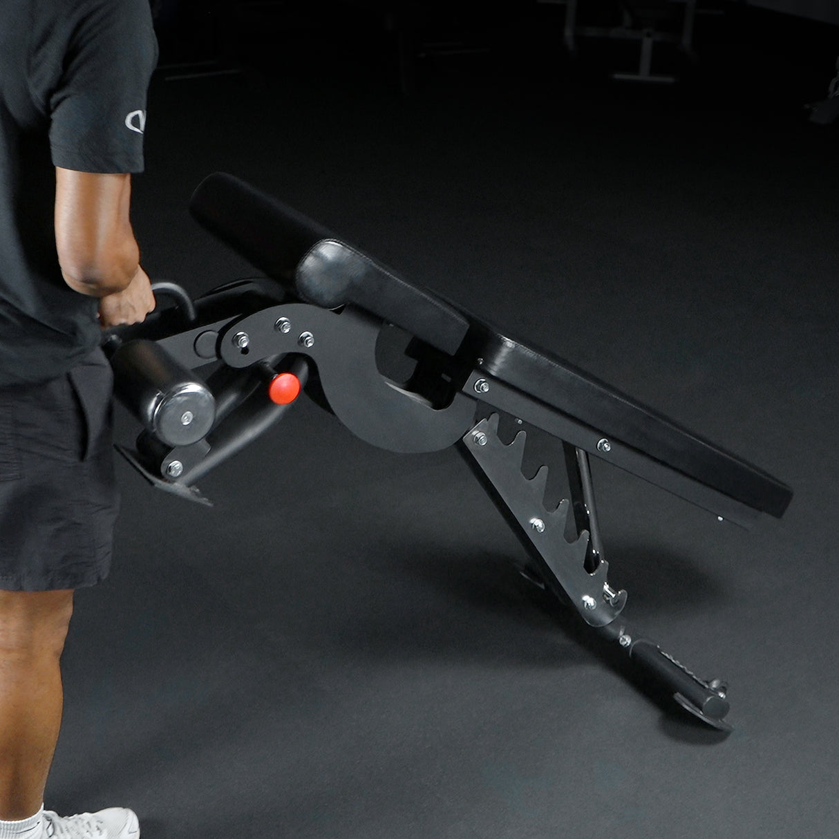 Using the built-in handle and wheels to move a gym weight bench