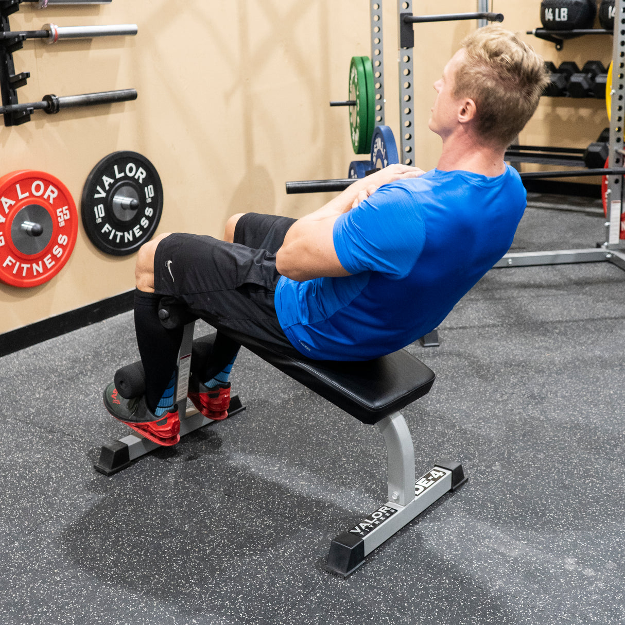 Sit-ups on a stationary decline sit-up bench