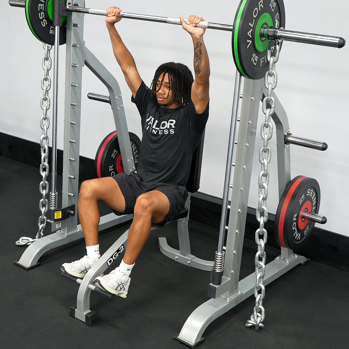 Overhead presses on a smith machine with resistance chains