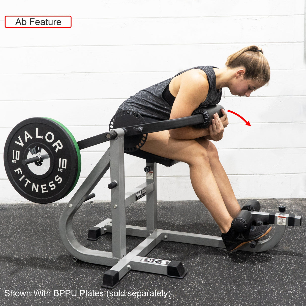Girl exercising an ab crunch on a dual-function ab and back workout machine