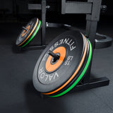 Weight plates stored on a combo squat and bench press rack with built-in plate storage pegs