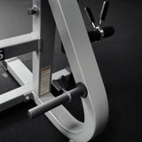 Included plate storage adapters and spring clips on a workout machine
